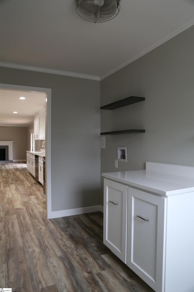 unfurnished dining area with crown molding and wood-type flooring