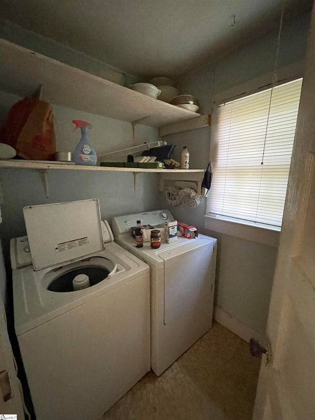 laundry area with independent washer and dryer