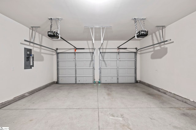 garage featuring a garage door opener and electric panel