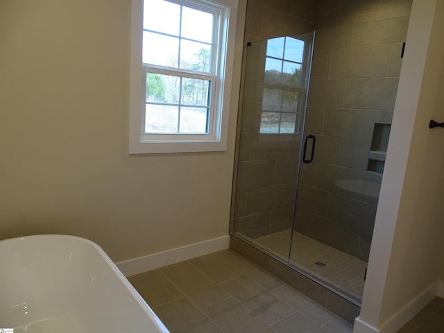 bathroom with shower with separate bathtub