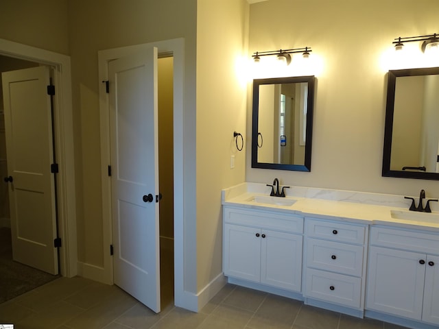 bathroom with tile patterned flooring and vanity