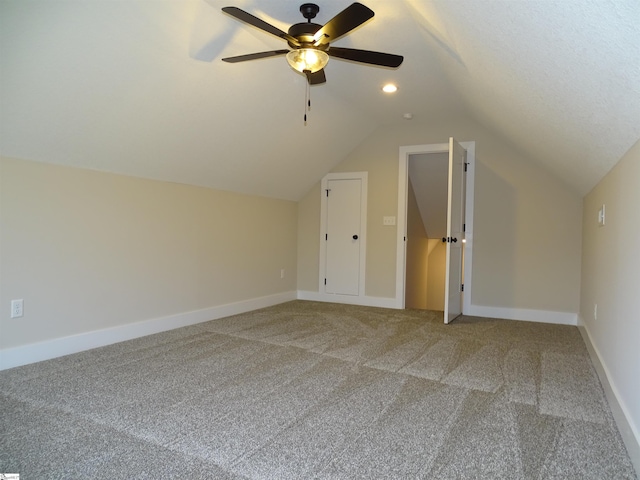 bonus room with carpet, vaulted ceiling, and ceiling fan