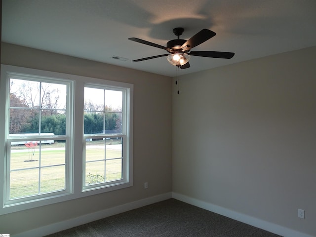 empty room with carpet and ceiling fan