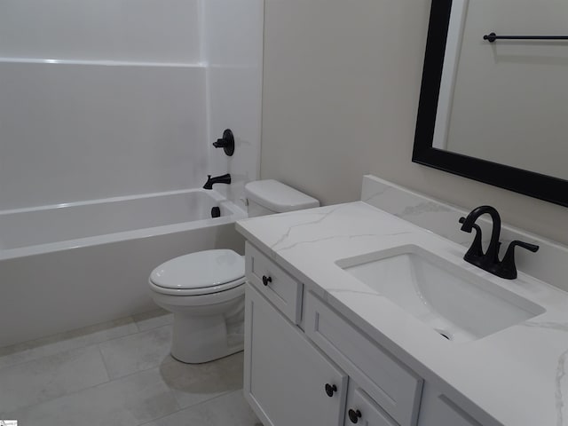 full bathroom featuring tile patterned floors, washtub / shower combination, vanity, and toilet