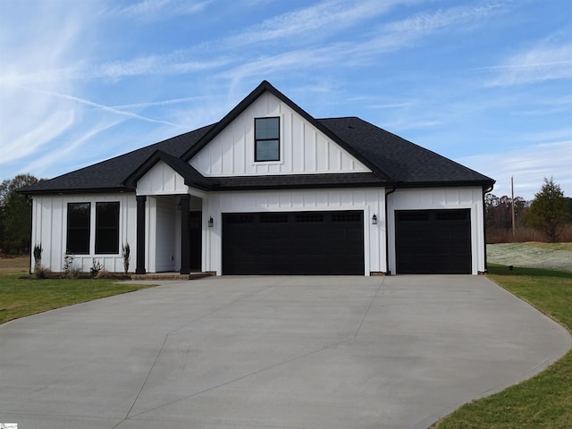 modern farmhouse style home with a garage and a front lawn