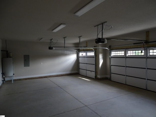 garage with electric panel and a garage door opener