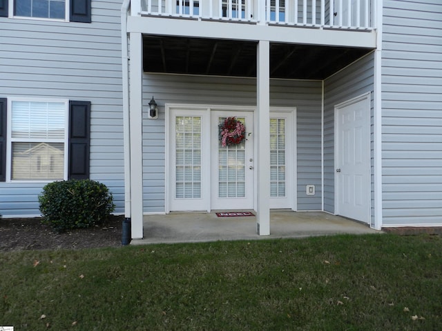 doorway to property featuring a patio and a balcony