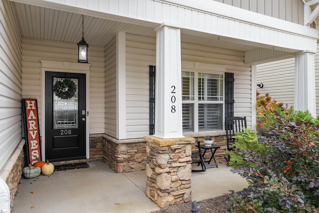 doorway to property with a porch