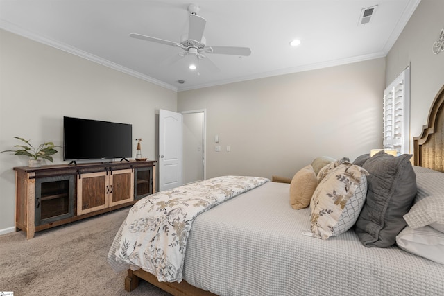 carpeted bedroom with ceiling fan and crown molding