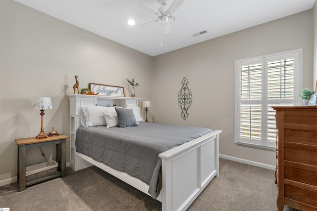 bedroom with ceiling fan and light colored carpet