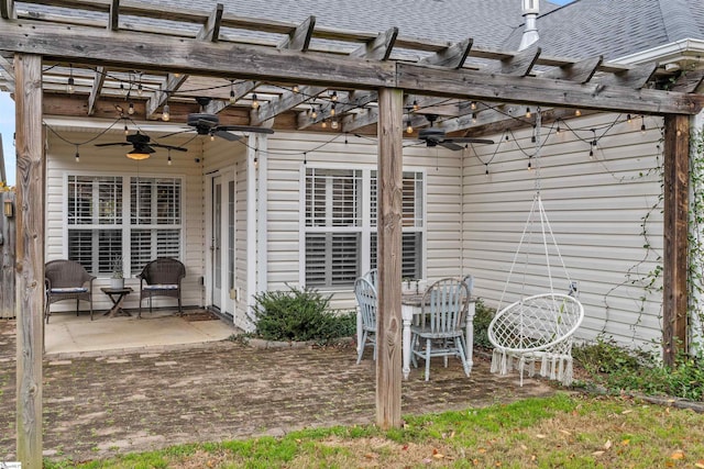 view of patio featuring a pergola and ceiling fan