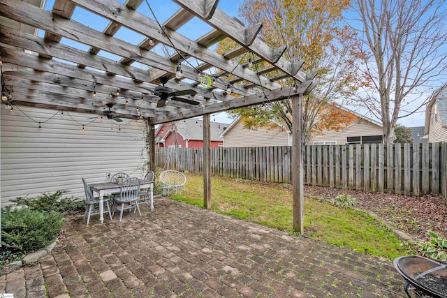 view of patio / terrace with ceiling fan and a pergola