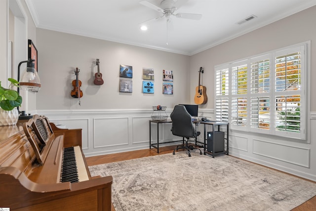 office area with crown molding, ceiling fan, and light hardwood / wood-style floors