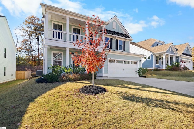 view of front of property featuring central AC, a front lawn, and a garage