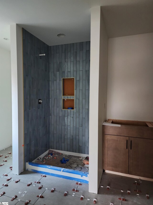 bathroom with wood walls