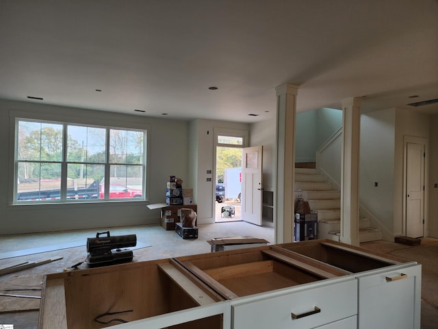 kitchen featuring white cabinetry and ornate columns