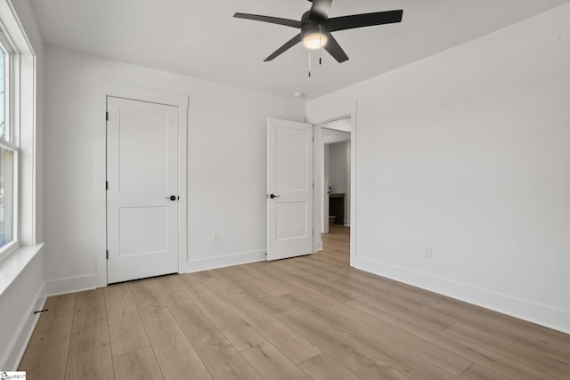 unfurnished bedroom featuring light hardwood / wood-style floors and ceiling fan