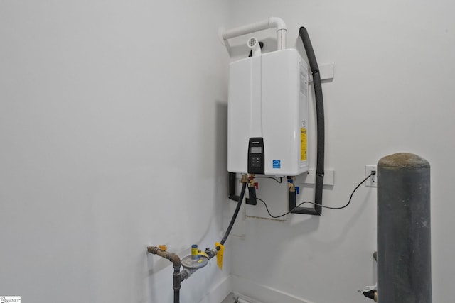 utility room with water heater