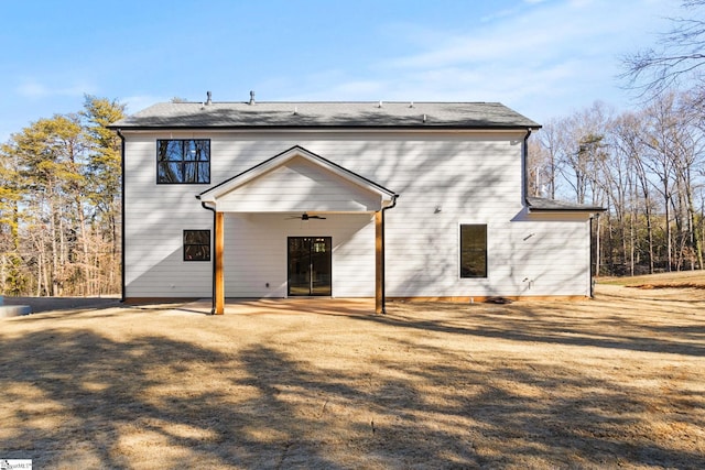 rear view of house featuring ceiling fan