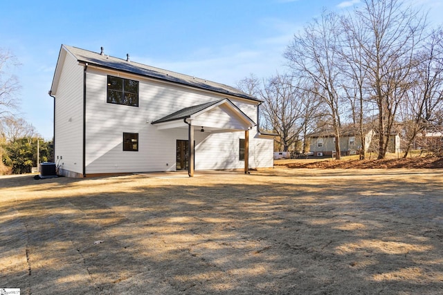 back of house featuring central AC unit