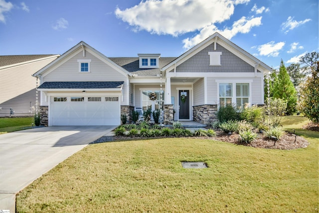 craftsman house with a front yard and a garage