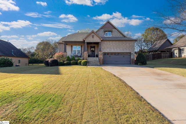 view of front facade featuring a front yard and a garage