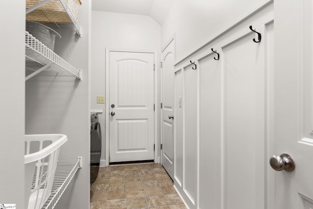 mudroom with washer / dryer and vaulted ceiling