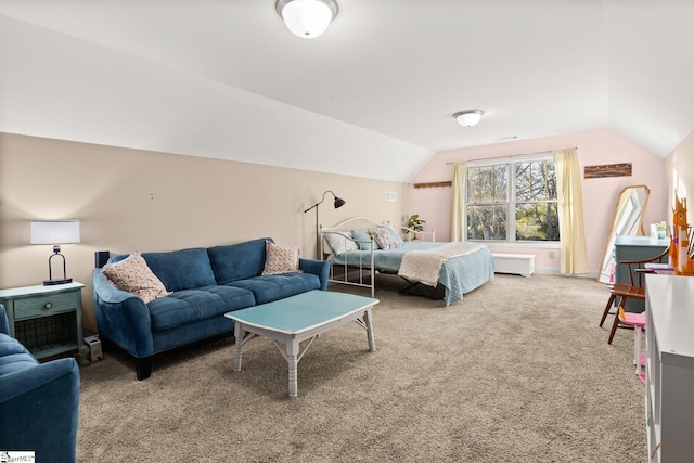 carpeted bedroom featuring lofted ceiling