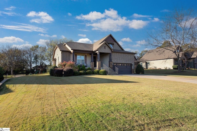 craftsman-style house featuring a front yard and a garage