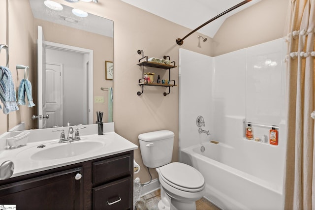 full bathroom featuring washtub / shower combination, vanity, toilet, and lofted ceiling