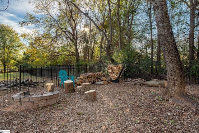 view of yard with a fire pit