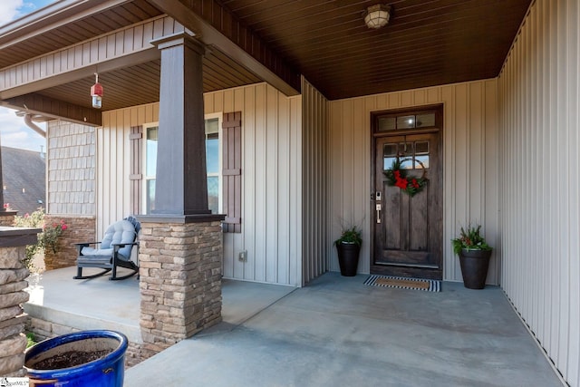 view of exterior entry with covered porch