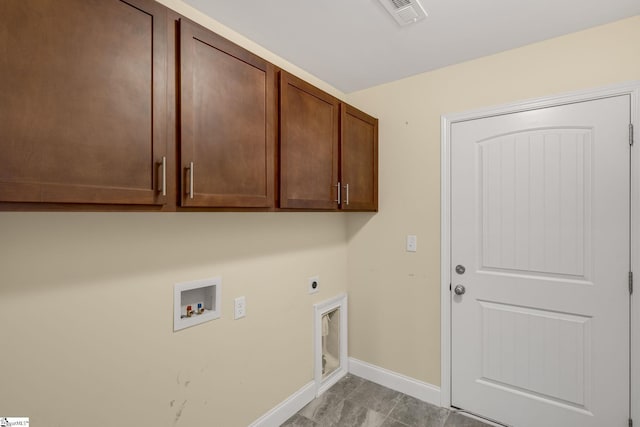 laundry area with electric dryer hookup, cabinets, and washer hookup