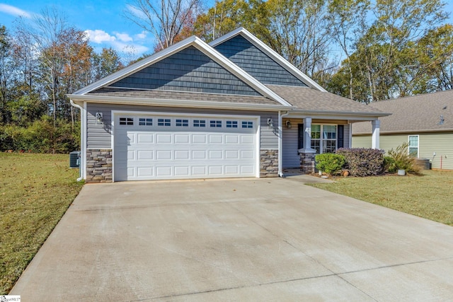 view of front facade featuring a garage and a front lawn