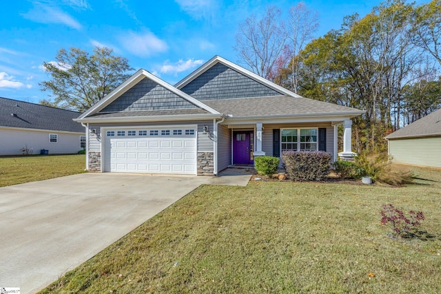 view of front of house with a garage and a front lawn