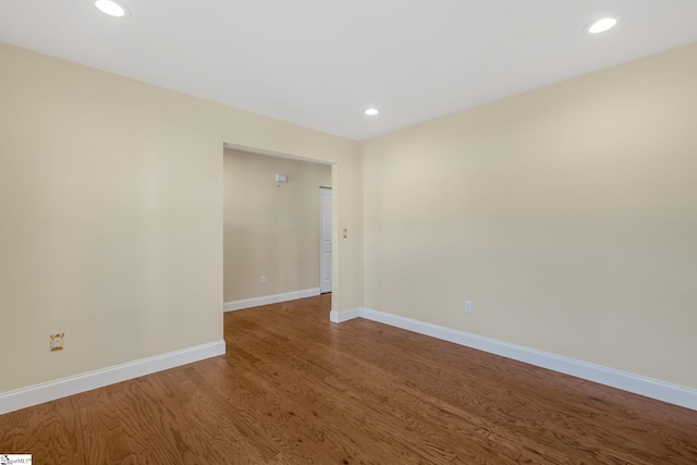 empty room featuring wood-type flooring