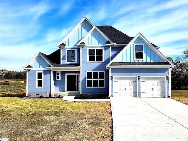 craftsman-style house with a garage and a front yard