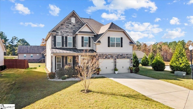 view of front of home featuring a front yard and a garage