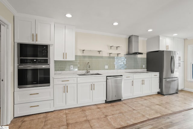 kitchen with appliances with stainless steel finishes, sink, crown molding, wall chimney exhaust hood, and white cabinets