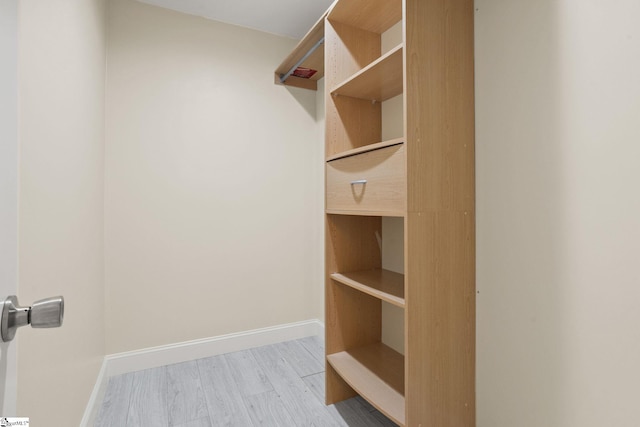 walk in closet featuring light wood-type flooring