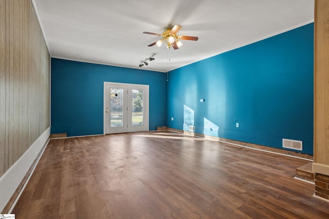 spare room featuring hardwood / wood-style floors, ceiling fan, and ornamental molding