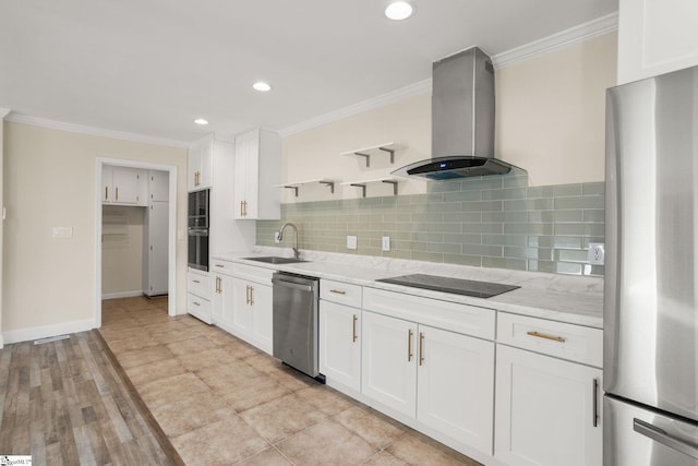 kitchen featuring white cabinetry, sink, black appliances, and wall chimney range hood