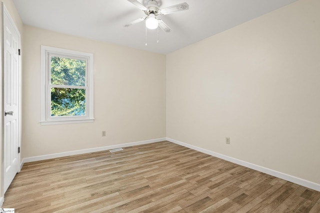 empty room featuring light wood-type flooring and ceiling fan