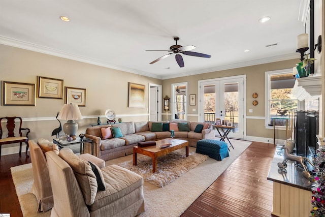 living room featuring french doors, dark hardwood / wood-style floors, ceiling fan, and crown molding