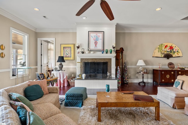 living room with hardwood / wood-style flooring and crown molding