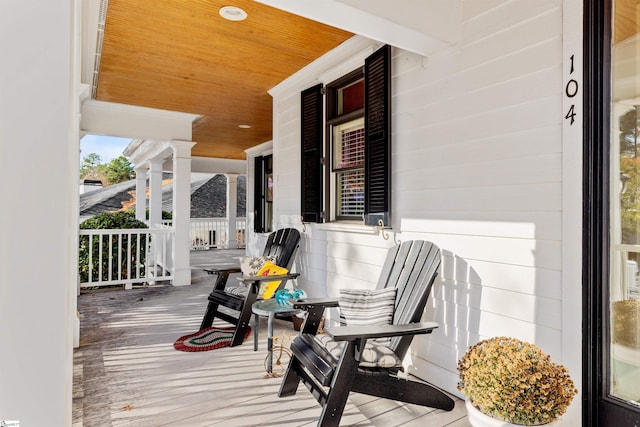 wooden deck featuring covered porch