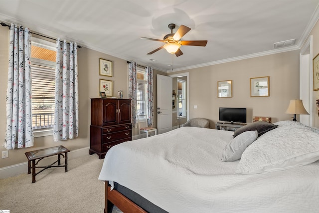 bedroom featuring ceiling fan, ornamental molding, light carpet, and multiple windows