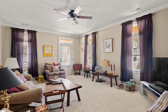 living room featuring light carpet, plenty of natural light, and ornamental molding