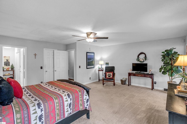 carpeted bedroom with a textured ceiling and ceiling fan