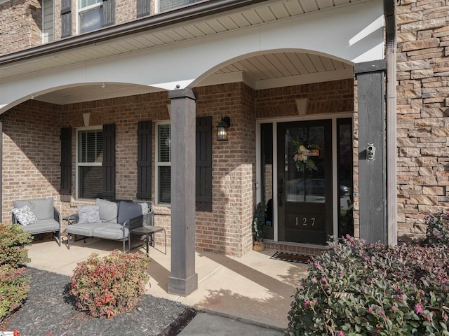 entrance to property featuring a porch